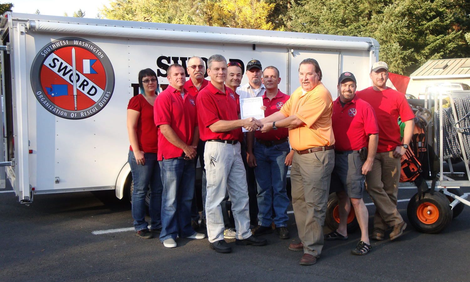 Contributed photo
Georgia-Pacific Camas mill manager Gary Kaiser (right) presents a check for $10,000 to members of the S.W.O.R.D. team including Misty Metz, Tyler McMahon, Larry Wagoner, Tim Woodring, Doug Young, Ron Gray, Jerry Lester, Jim Virgin and Luke McCall.