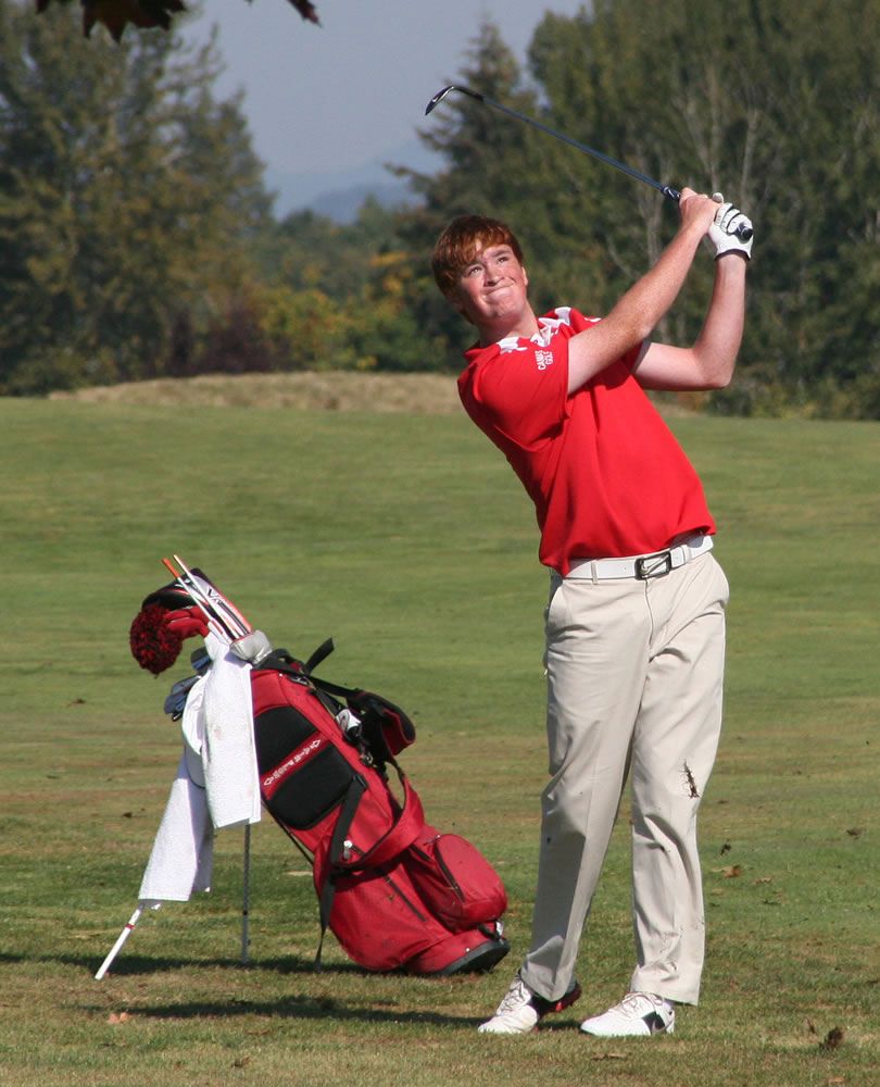 Camas freshman Brian Humphreys watches his chip shot take flight during the final round of the 4A district golf tournament Oct. 9, at the Tri-Mountain golf course.