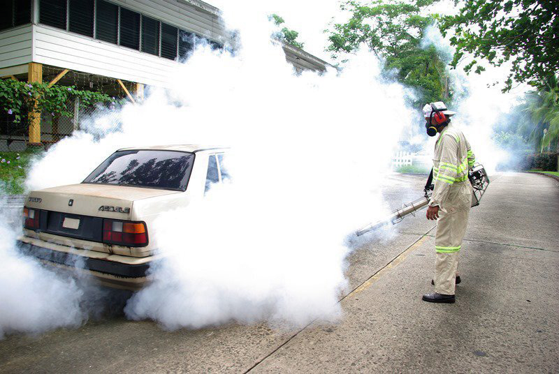 A Health Ministry worker fumigates an area near the Panama Canal in July.