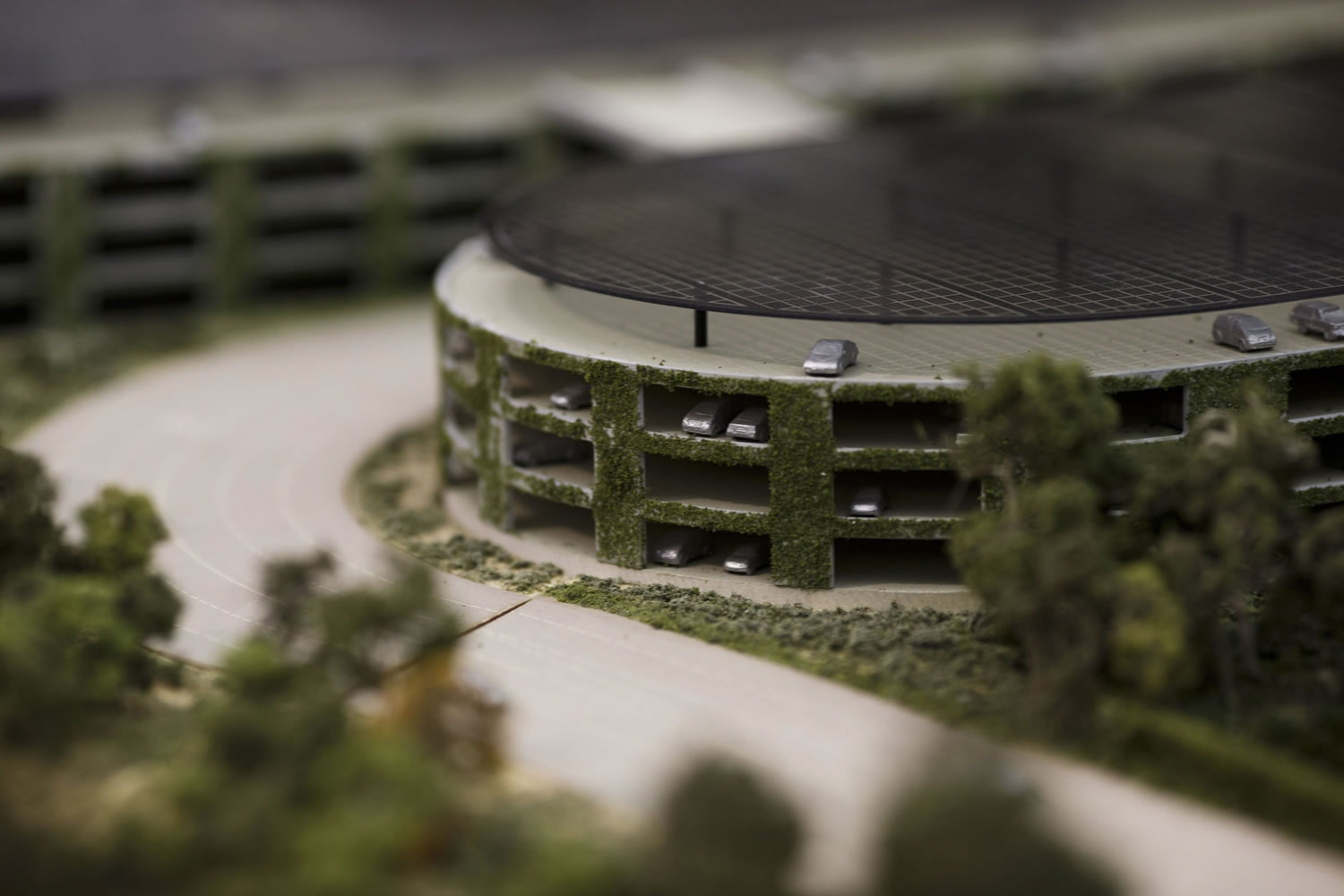 A rendering of Apple's proposed new campus in Cupertino, Calif., includes parking structures with solar panel, as shown on this model.