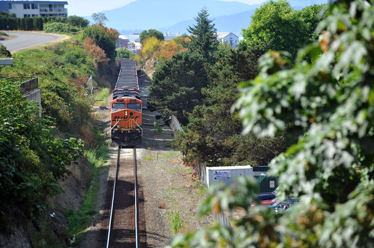 An empty coal train heads south in Bellingham.