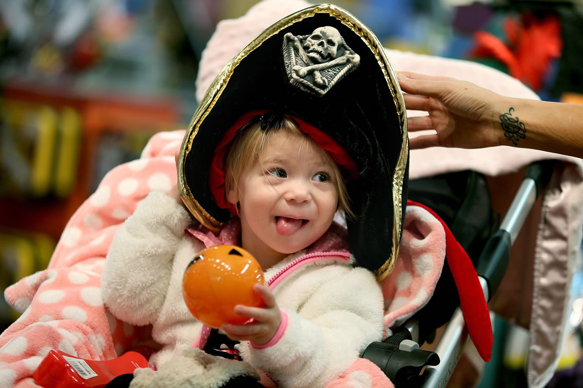 Arya Kubesh, 19 months, dons a pirate hat for Halloween at Creative Kidstuff at Galleria Mall in Edina, Minn., on Oct.