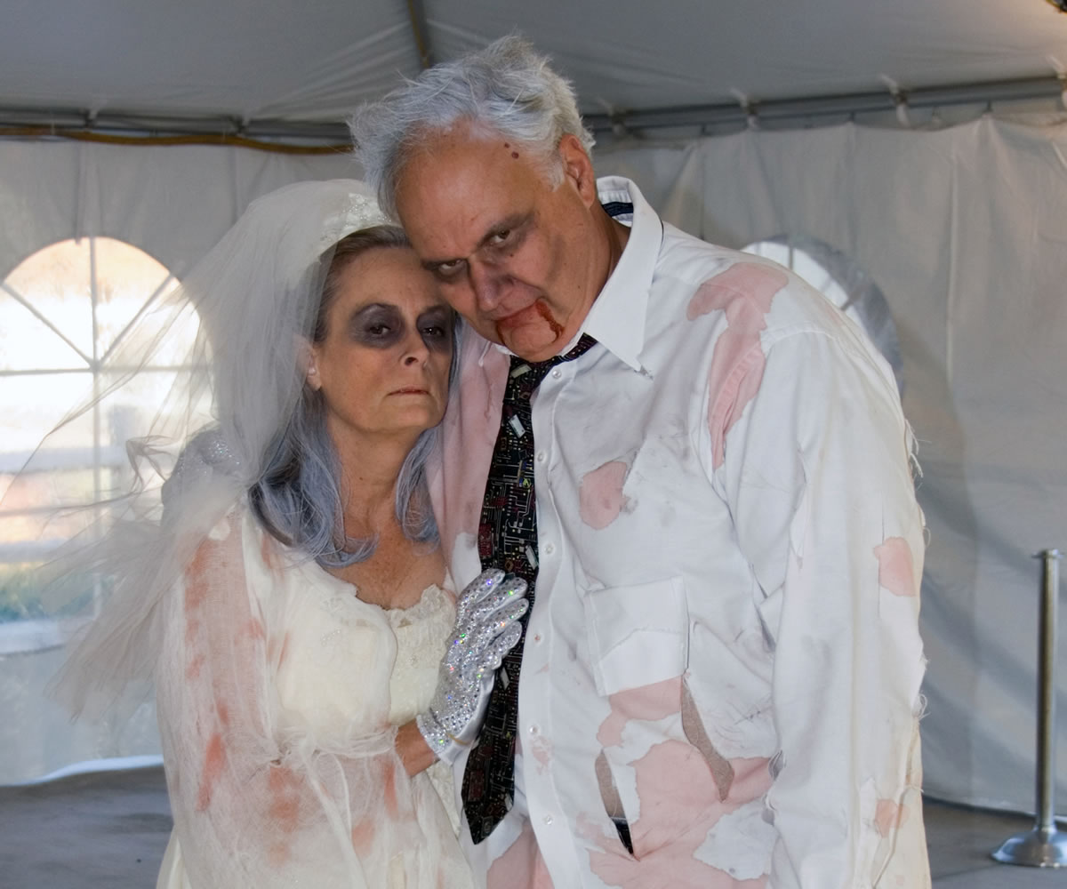 &quot;Zombie bride and groom,&quot; Linda and Mike Harnish enjoy the festivities during a performance at Camas Meadows.