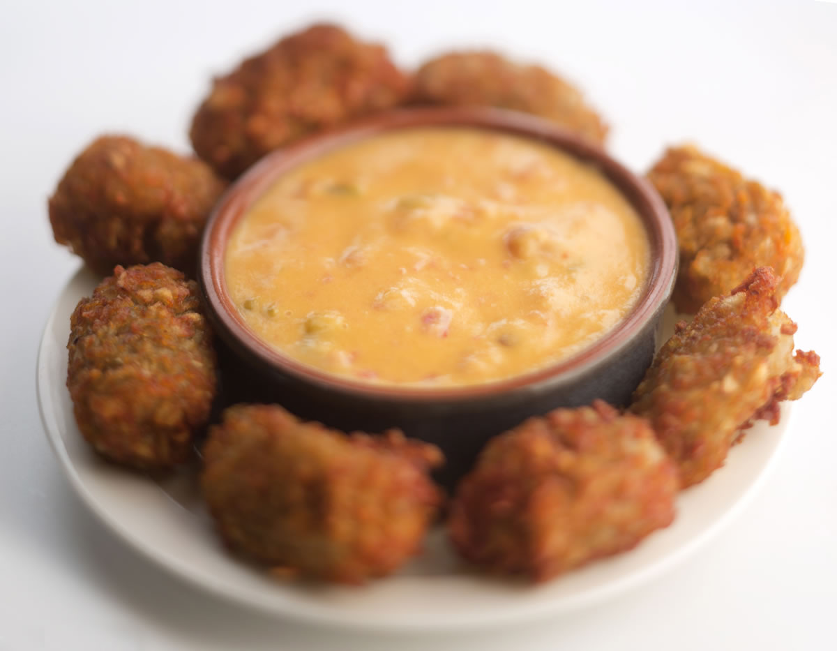 Homemade potato tots with dipping sauce.