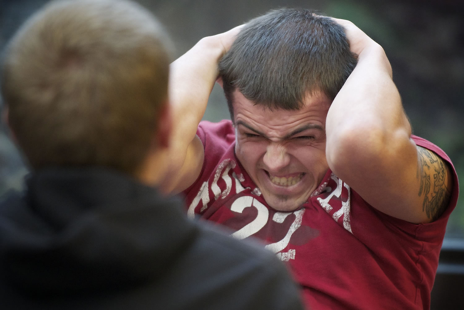 Chris Roper, 24, of Vancouver takes a sit-up test during an open cadet testing event hosted Saturday by the Washington State Patrol. Roper completed 32 sit-ups during the one-minute test, six short of the required minimum for his age group.
