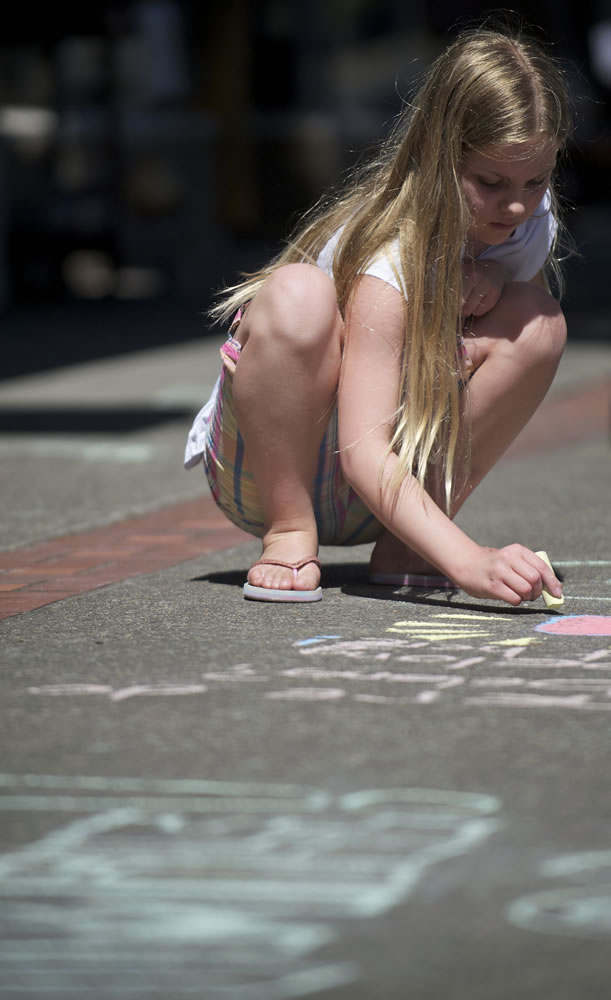 Junior Joy Team member Faith Ahola, 10, said Tuesday she participated in Chalk the Walks in uptown Vancouver to help people feel better about themselves.