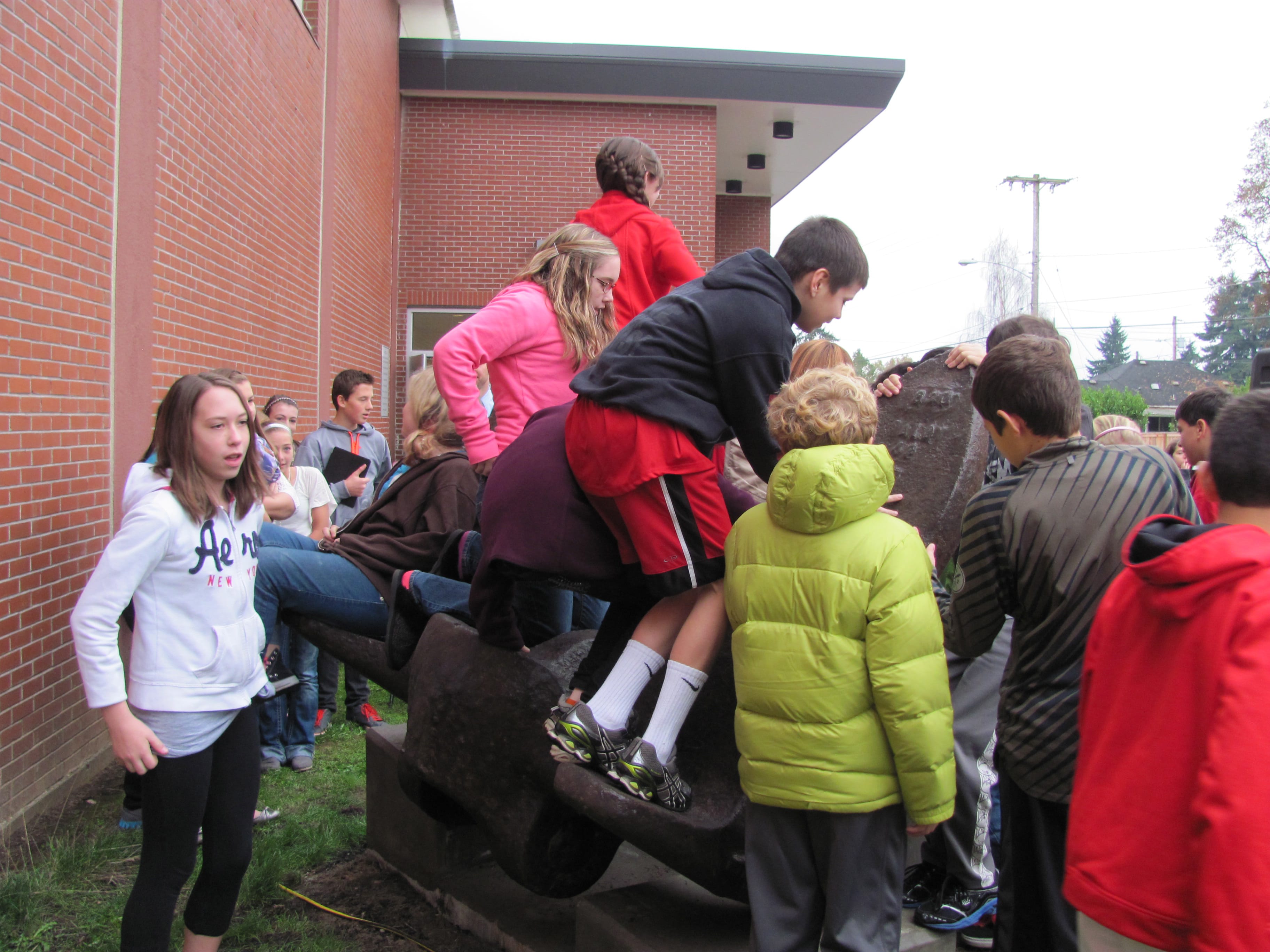 Liberty Middle School students climb on the anchor which was once a part of the SS Davy Crockett, a World War II Liberty ship. &quot;It's a community art piece,&quot; principal Marilyn Boerke said.