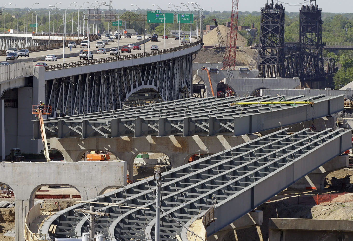 The steel skeleton for the eastern end of the new Innerbelt Bridge in Cleveland sits next to the existing span. The House on Thursday voted overwhelmingly in favor of final passage of a 5-year, $305 billion bill that boosts highway and transit spending.