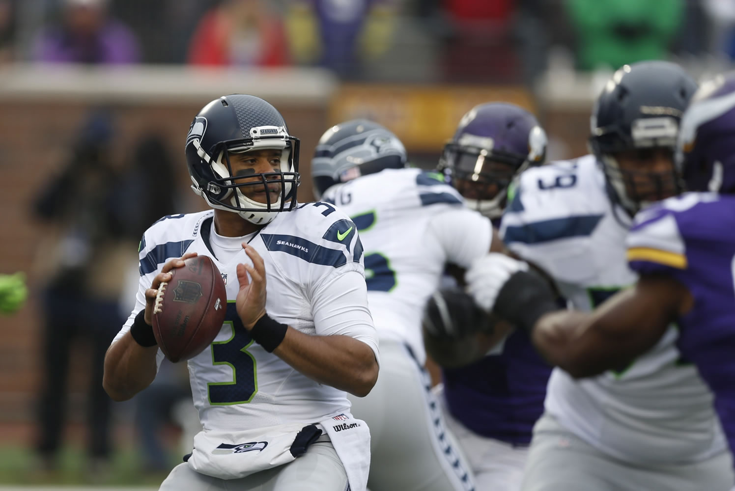 Seattle Seahawks quarterback Russell Wilson (3) looks to throw against the Minnesota Vikings in the first half in Minneapolis. The Seattle Seahawks will play the Baltimore Ravens on Sunday, Dec. 13, 2015.