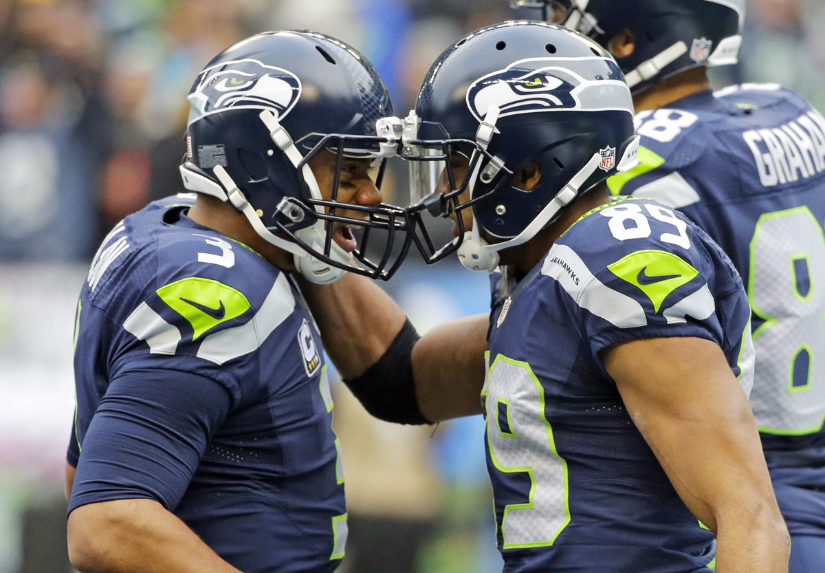 Seattle quarterback Russell Wilson, left, and wide receiver Doug Baldwin, right, have connected for 17 catches, 321 yards and eight touchdowns in the Seahawks&#039; last three games. (Ted S.