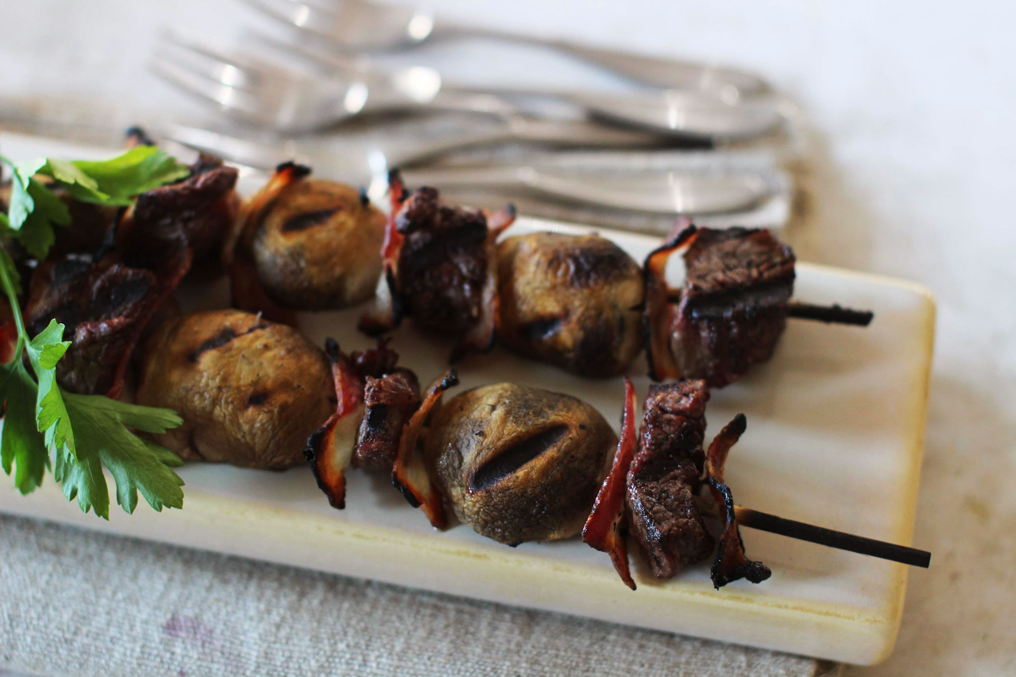 Steakhouse Kebabs With Mushrooms and Bacon (Matthew Mead/Associated Press)