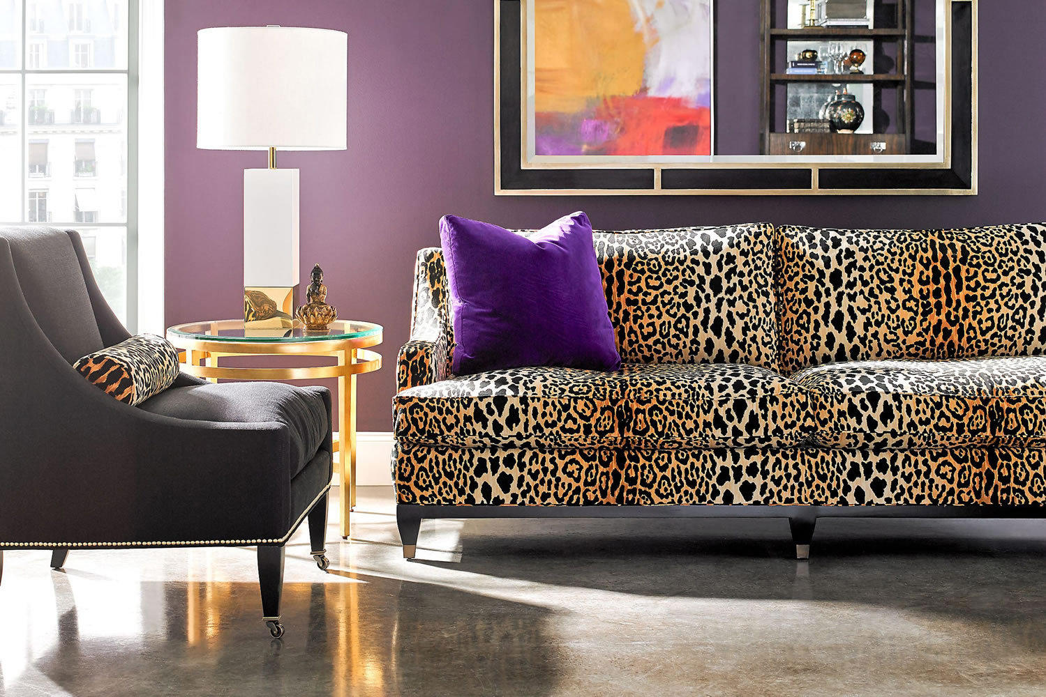 Condo design: living room with leopard sofa and bright patterns