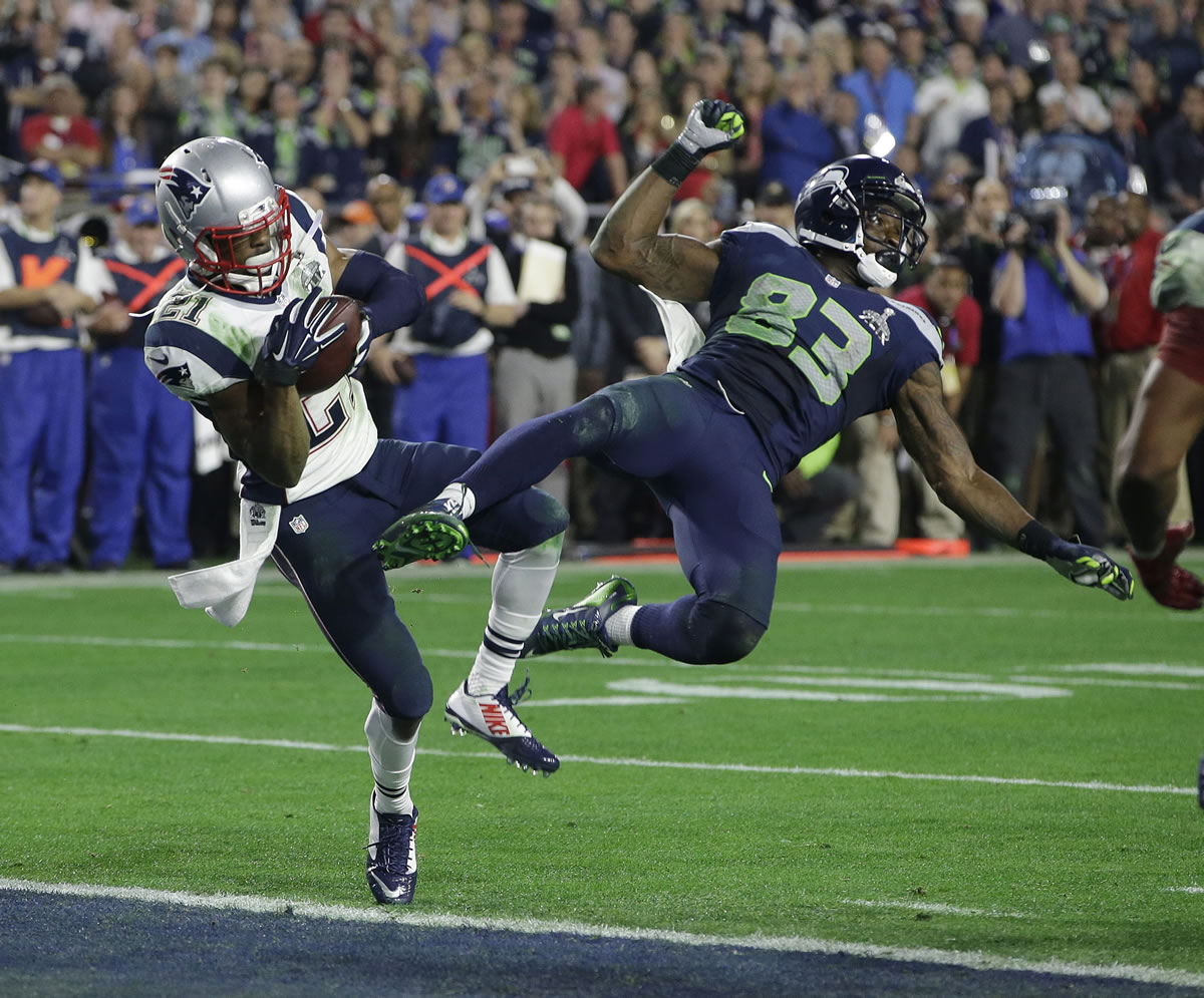 FILE - In this Feb. 1, 2015, file photo, New England Patriots cornerback Malcolm Butler (21) intercepts a pass intended for Seattle Seahawks wide receiver Ricardo Lockette during the NFL Super Bowl XLIX football game in Glendale, Ariz.