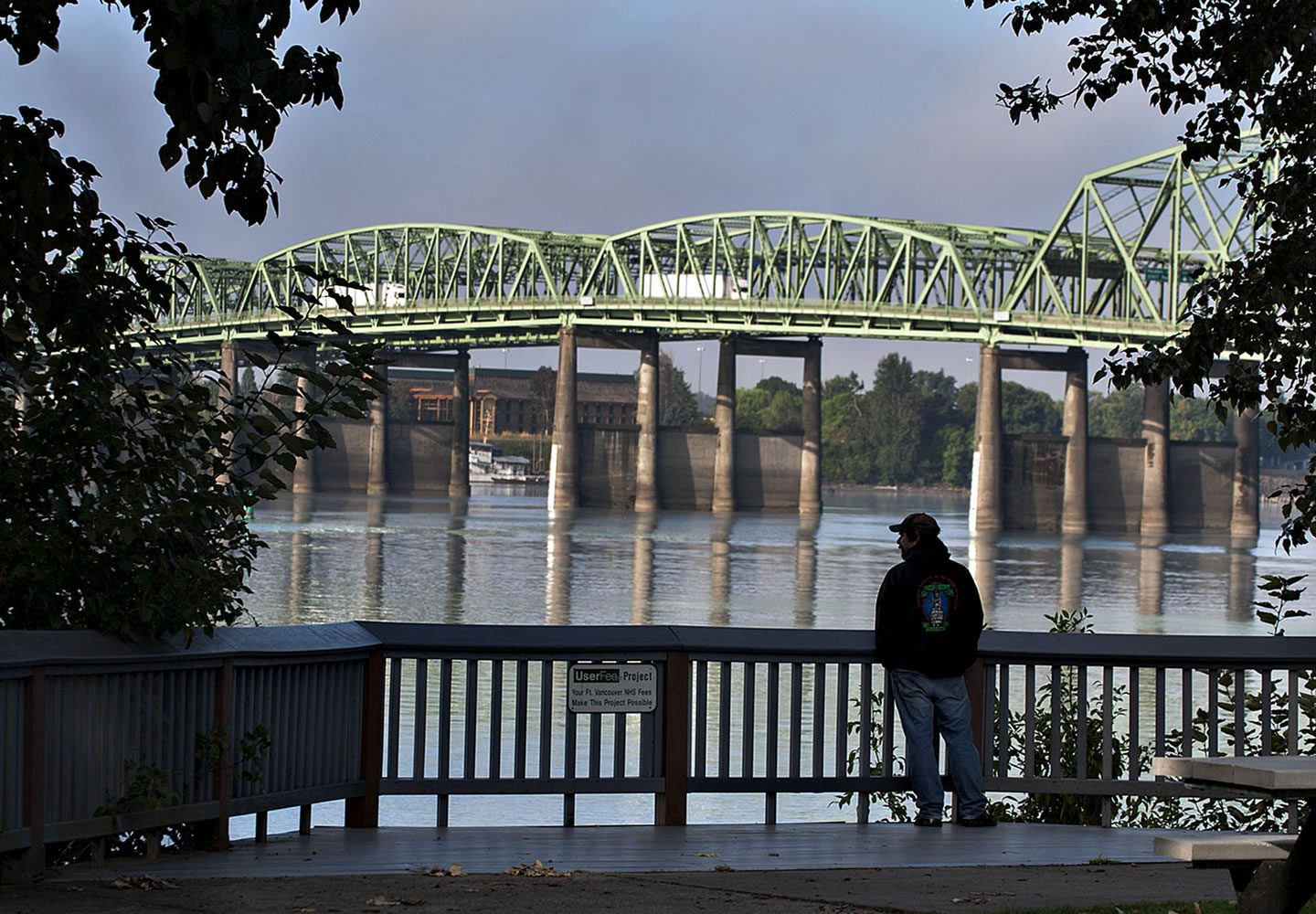 Jeff McBride of Vancouver spends a peaceful moment before work checking out scenic views of the Interstate Bridge and the Columbia River on Thursday morning, Sept. 3, 2015. McBride, who has lived in the area for 10 years, said he is looking forward to the development of the waterfront area.