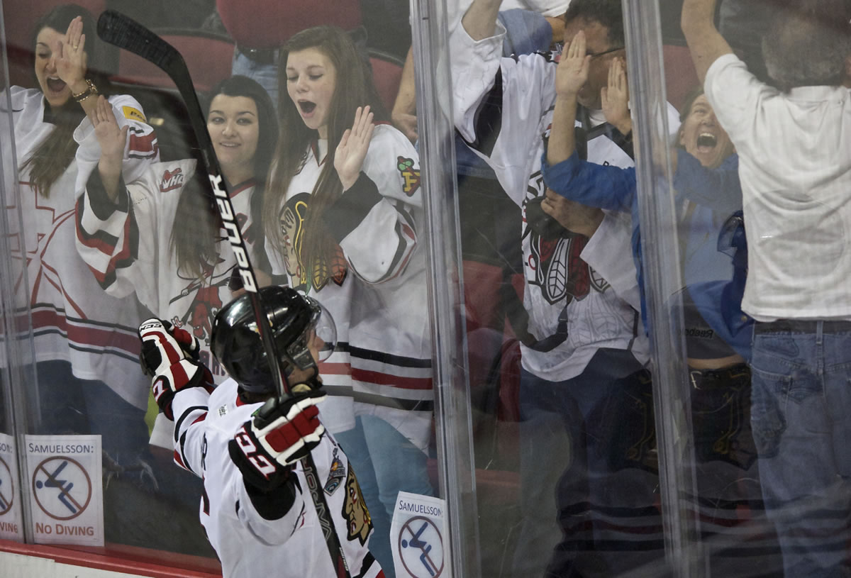 The Winterhawks' Joey Baker celebrates his goal 15 seconds in to the first period Friday.