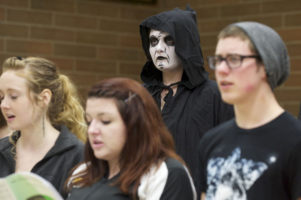 Prairie High School senior Elizabeth Perry, 18, stands in her choir class after she &quot;died&quot; in a car crash during the Every 15 Minutes program. Students were removed from class, put on a black robe and face paint and returned, silently, to class.