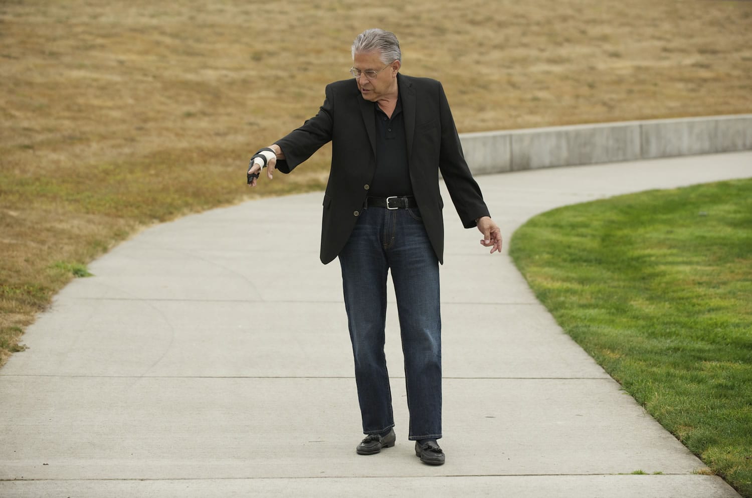 Gerry Matthieu revisits the scene of a Sept. 8 attack by a dog at Greyhawk Community Park on Thursday.