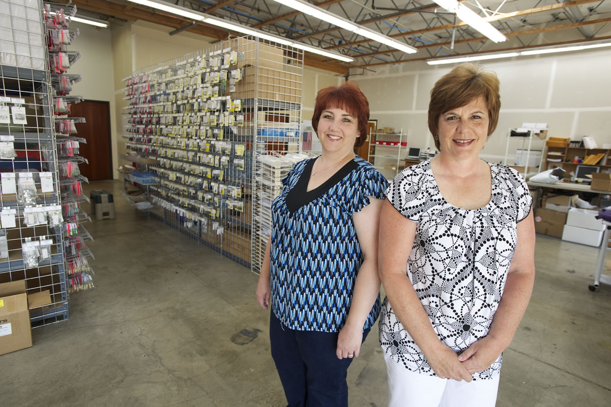 Angela DiBetta, left, and Julie Schoen, owners of Dazzling Designs &amp; Apparel, Inc., launched their company 10 years ago after DiBetta &quot;fell in love&quot; with rhinestone-studded apparel.