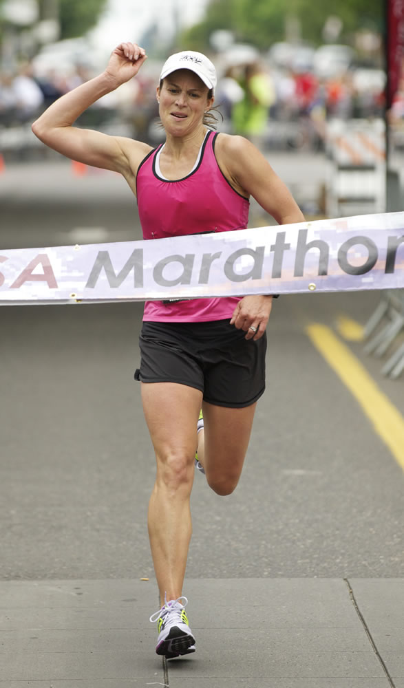 Jennifer Enge of Lake Oswego won the women's marathon by nearly 2 minutes over the runner up in 2:58:54.