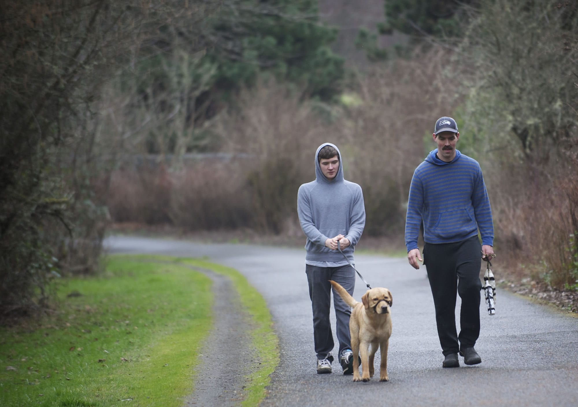 It was a bird-dog training day for Aaron Shinn, right, his son Buck, 16, and Charlie, their 11-month-old yellow lab.