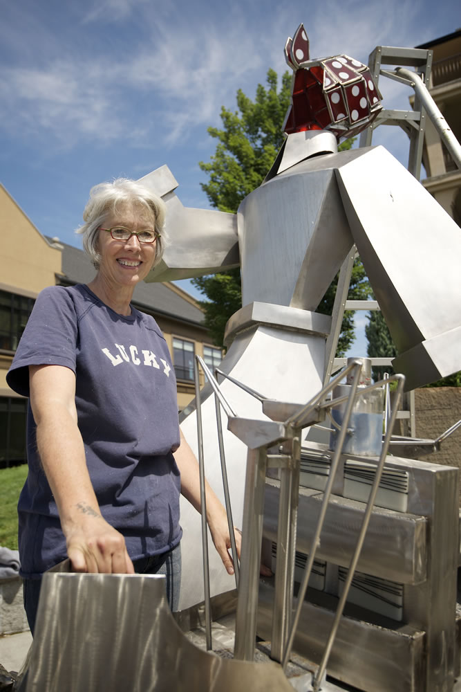 After the replacing the head, artist Sharon Warman Agnor stands in front of the &quot;Wendy Rose&quot; sculpture.
