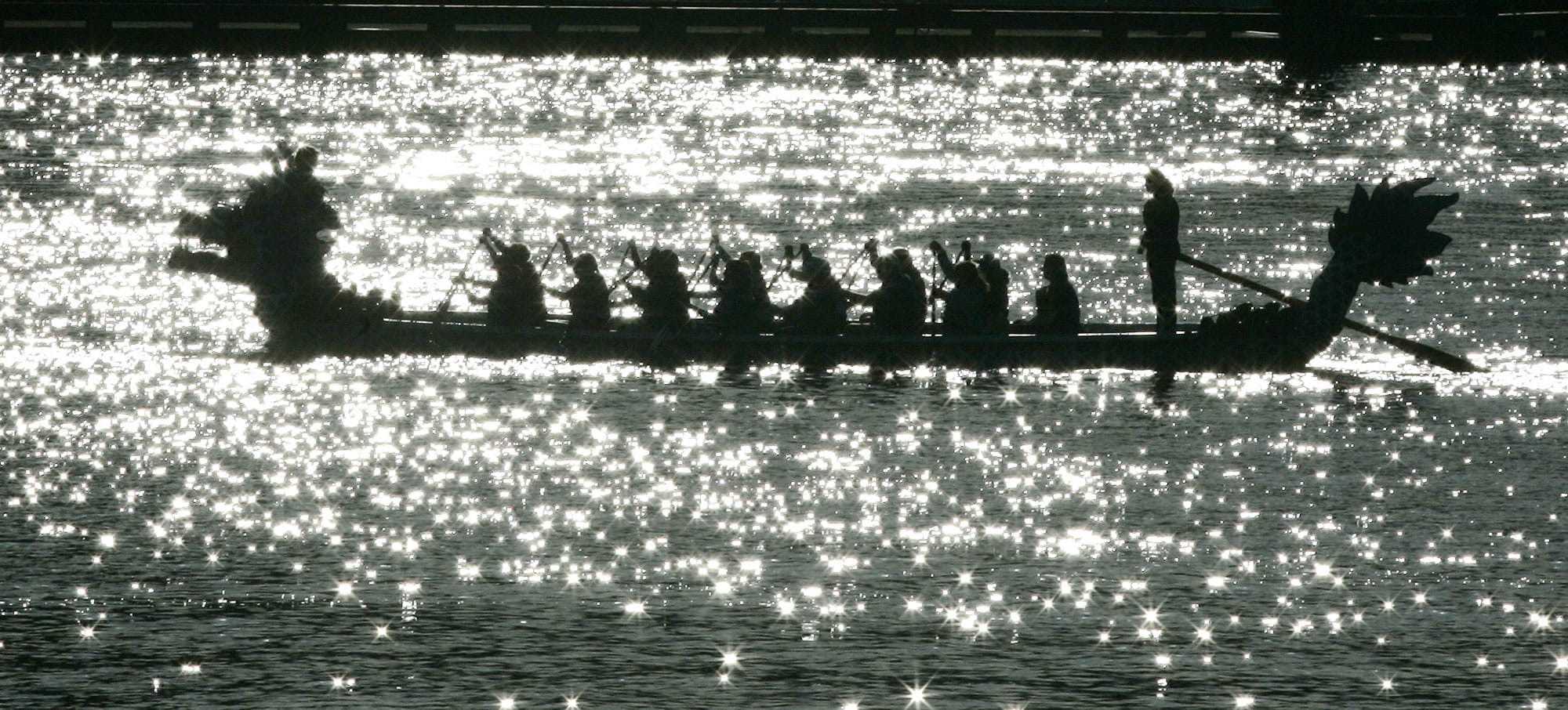 A dragon boat team paddles down the Willamette River in Portland in April 2007.