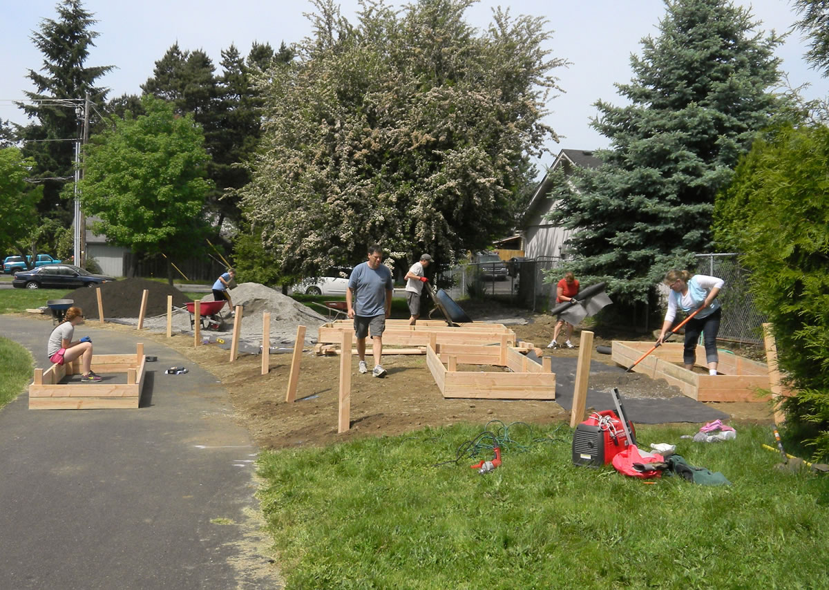 Bella Vista: Neighborhood volunteers build raised-bed  gardens in the park May 19.