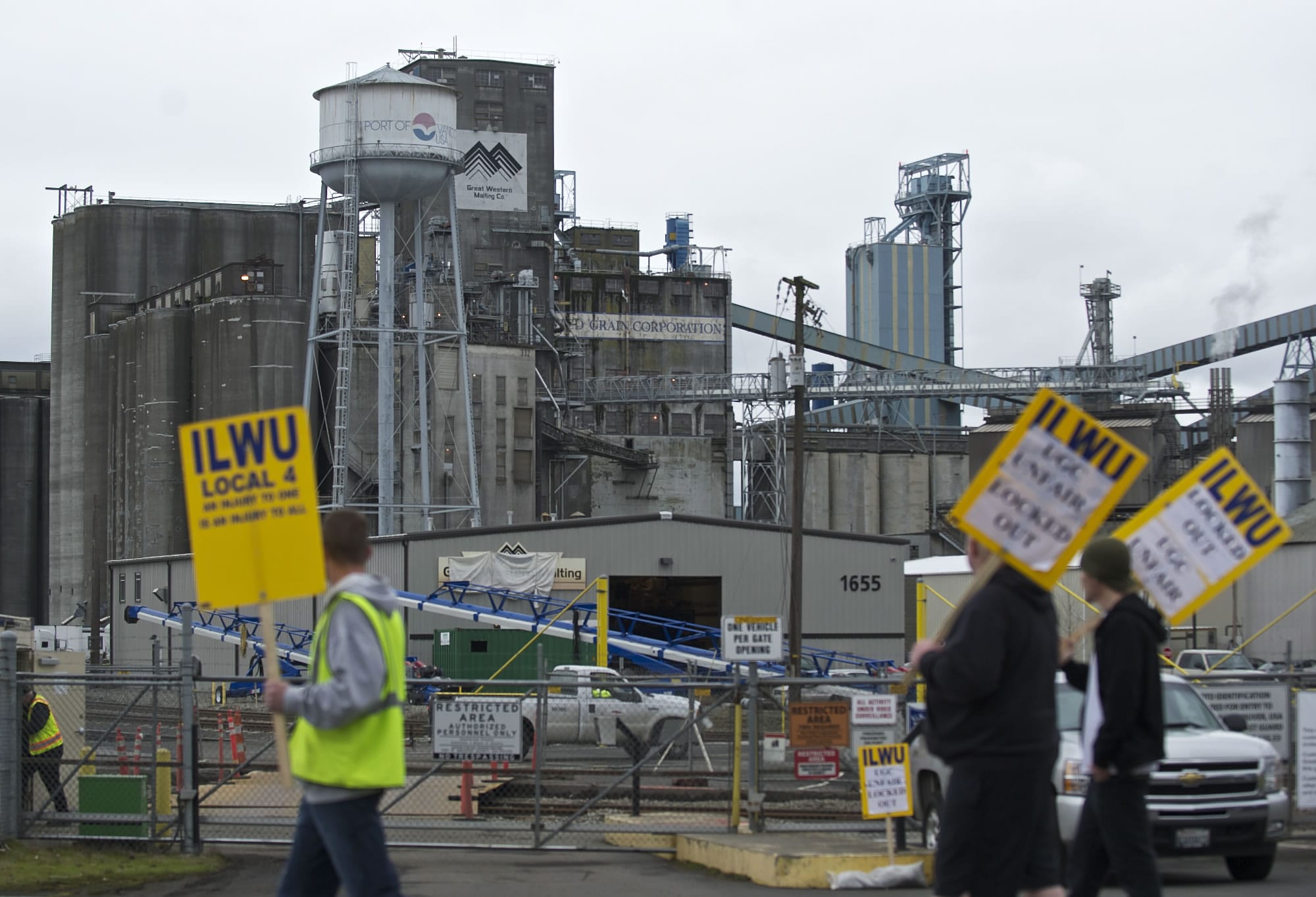 ILWU workers walk the picket line on day three of a lockout by United Grain Corp.