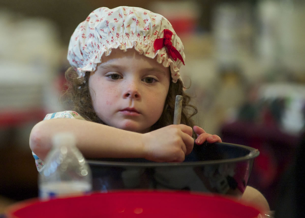 Lily Ritton, 5, of Venersborg helps make strawberry freezer jam during Homestead Day at the Venersborg Schoolhouse on Sunday.