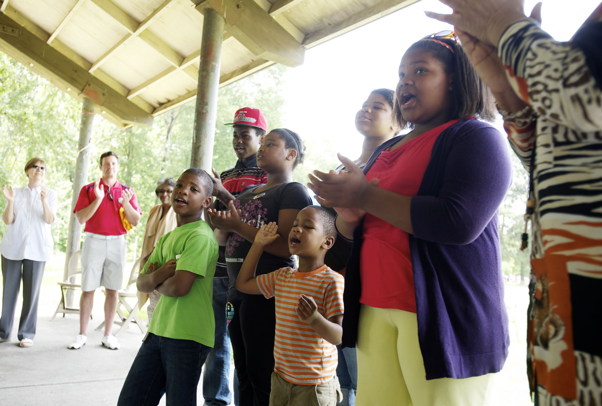Ethell Tillis, far right, leads 6 of her 26 grandchildren, from left, Nickelas Butcher, 6, Quintin Nickelson, 15, Hfope Butcher, 12, Jabar Thomas, 4, Grace Nickelson, 14, and Fayth Butcher, 12, as they sing &quot;Oh Happy Day&quot; on Saturday at the Juneteenth celebration at Marine Park in Vancouver.