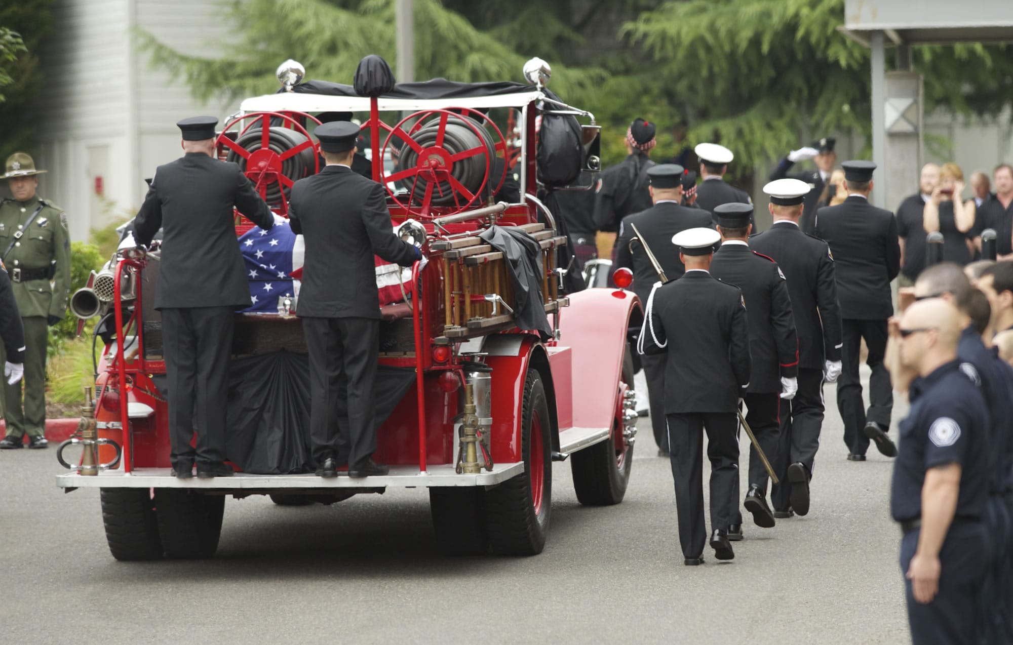 Firefighter Robert W. Hamel's casket was placed at the rear of an antique fire rig, Engine 0, and driven from downtown Vancouver to Crossroads Community Church, where his service was held.