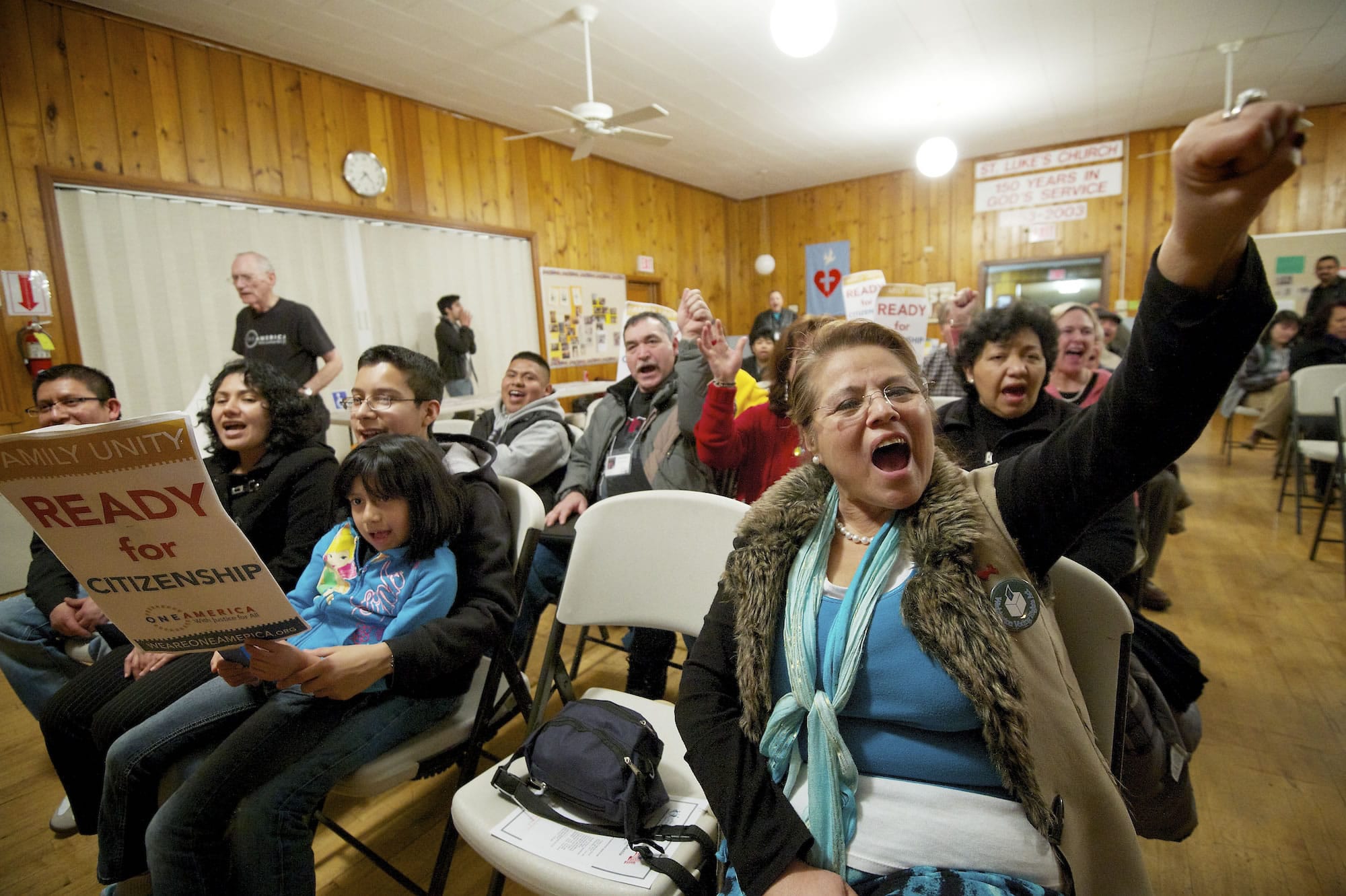 Lupe Sanchez of Yakima, right, shouts for immigration reform at a rally Tuesday at St. Luke's Episcopal Church in Vancouver. The rally began a statewide bus tour advocating for comprehensive immigration reform.