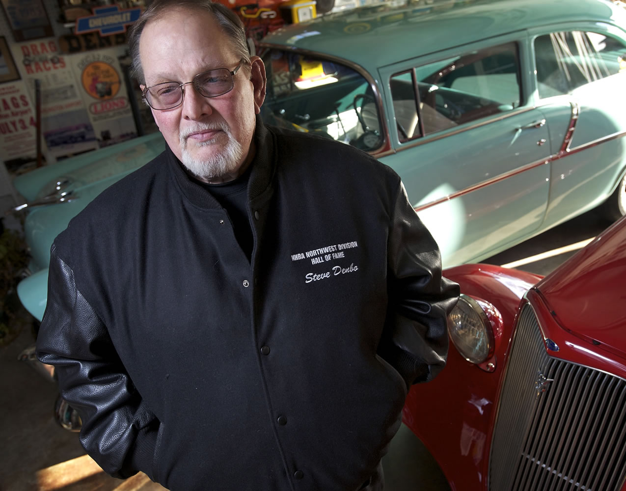 Steve Denbo, who was inducted into the NHRA hall of fame last weekend, poses with his cars at his Hazel Dell home.