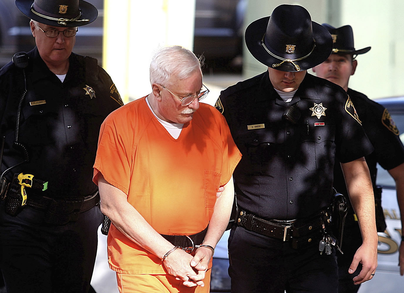 Jack McCullough is escorted into the DeKalb County Courthouse in Sycamore, Ill., by DeKalb County Sheriff's deputies Sept. 4. Friday, Sept. 14, in Sycamore Judge James Hallock pronounced McCullough guilty of murder, kidnapping and abduction in the 1957 death of 7-year-old Maria Ridulph of Sycamore.