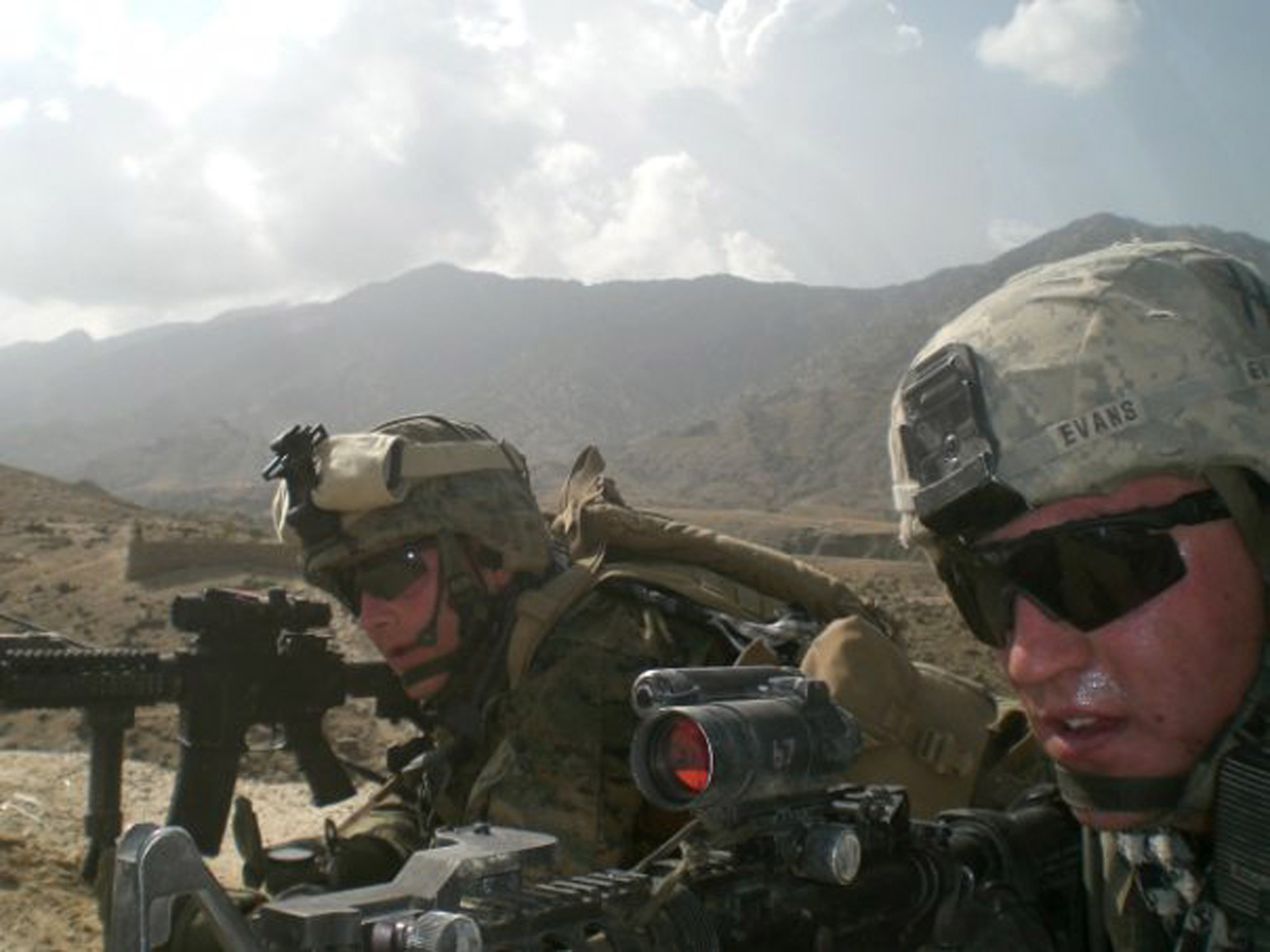 This 2009 photo provided by Lisa Freeman shows her son, Marine Capt. Matthew C. Freeman, left, in Afghanistan. Barely two weeks into his deployment, Freeman and a fire support team set out to do reconnaissance in the Shpee Valley when they came under almost immediate enemy attack and became pinned down. According to an official account, Freeman fought his way into a nearby building and up to the roof to get a better angle on the enemy position. Once atop, he spotted an insurgent with a rocket-propelled grenade and was firing at the man when he was shot in the back of the head.