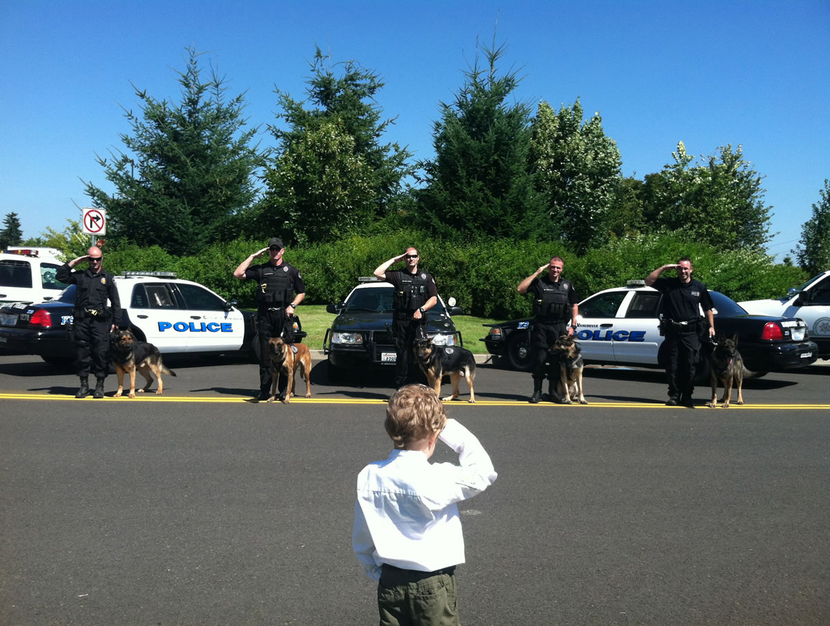 Andresen/St. Johns: Clark County's honorary sheriff Carter Harris got a chance to &quot;inspect&quot; K-9 teams Aug. 1. The 5-year-old, diagnosed with leukemia in 2010, was a participant in the Washington State Chief for a Day program last year.