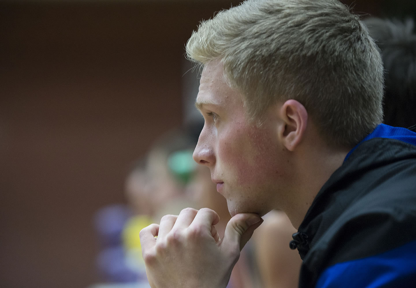 Mountain View senior Jake Ryan watches the action from the bench Tuesday night, Dec. 15, 2015 at Heritage High School.