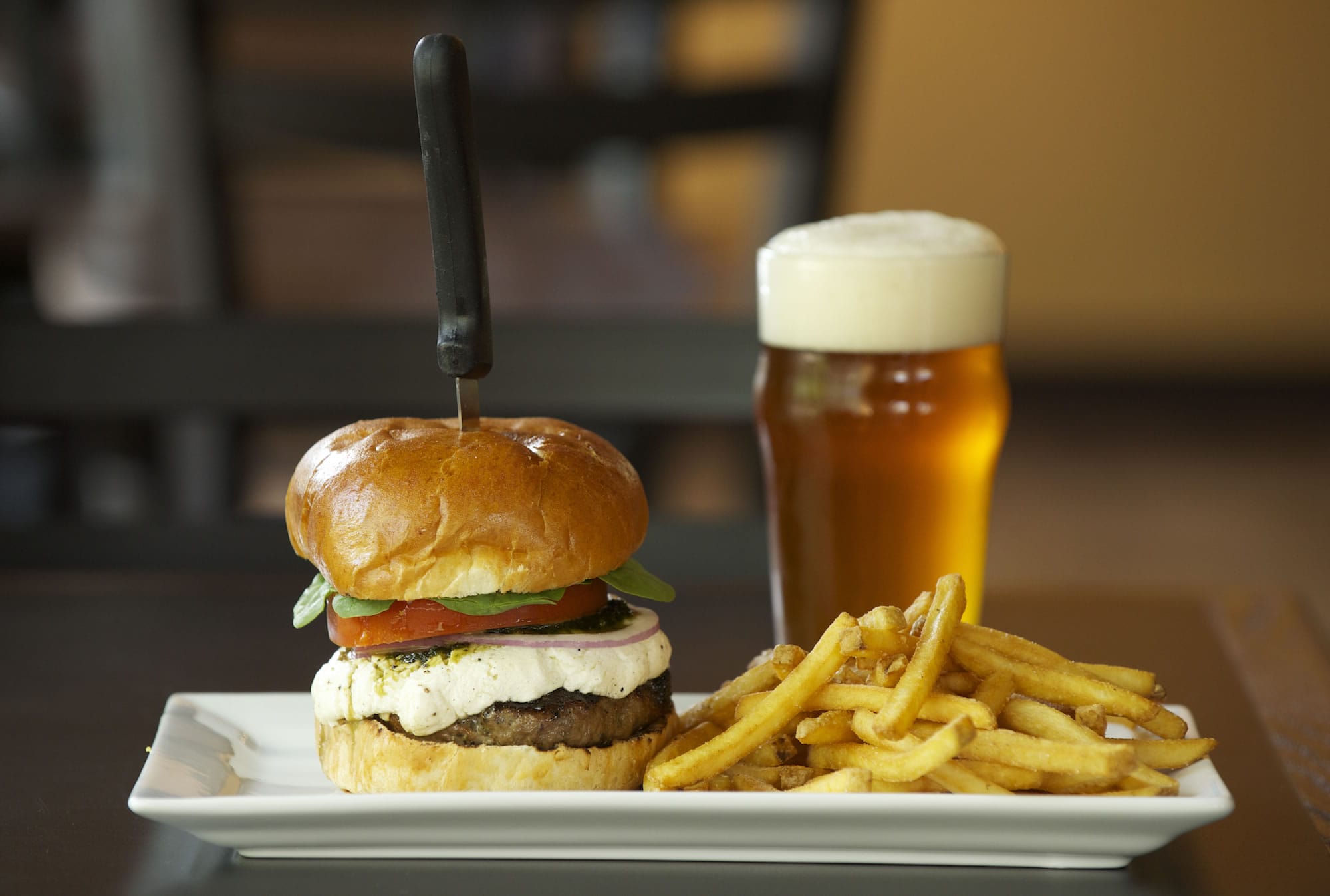 The Mill City lamb burger with fries and beer are among the offerings at Mill City Brew Werks in Camas.