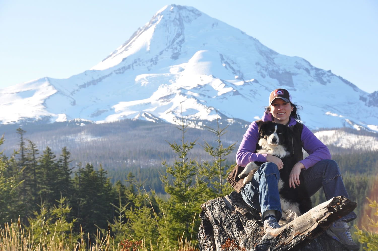 Erin Coburn of Vancouver and her dog, Stihl, pose for a photo after hiking though Mount Hood National Forest last winter to cut down a Christmas tree.