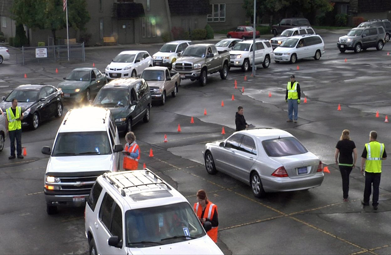 A line of vehicles forms in a parking lot laid out with traffic cones for a typical Zaycon Foods meat delivery &quot;event.&quot; Zaycon is based in Spokane and delivers beef, fish, chicken, ham and bacon to parking lots across the nation, including Clark County at the Vancouver First Friends Church, 2710 N.E.