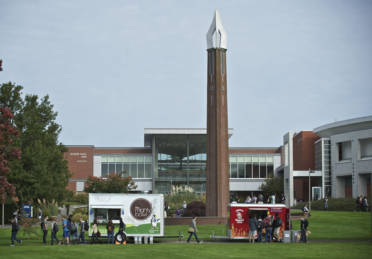 Hungry students, faculty and staff order lunch from The Mighty Bowl, left, and Chewy's Burritos &amp; More on the Clark College campus on Wednesday.
