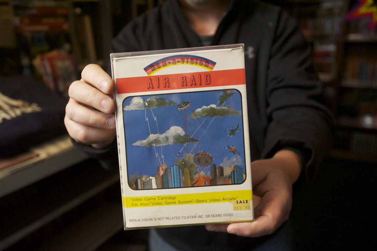 Vancouver resident Rick Weis holds up his copy of &quot;Air Raid,&quot; one of the worst Atari 2600 games ever made, which ironically also makes it one of the most collectable, he said -- few exist because few people bought them.