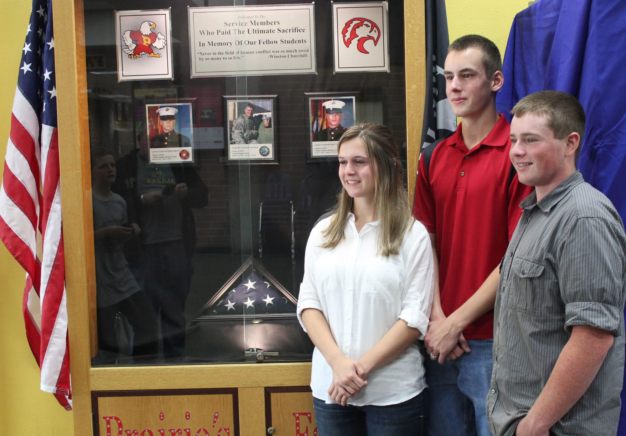 Brush Prairie: Prairie High School students Samantha Willson, from left, Casey McNicholas and Brett Udy, unveiled a school memorial June 13 they created to honor three local military members who died while serving in the Middle East.