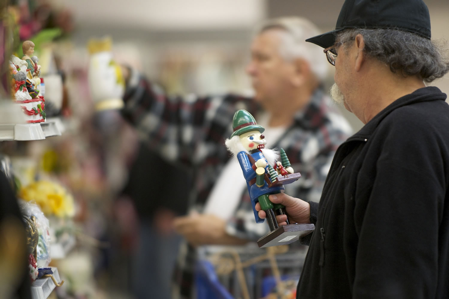 Fred Soto of Vancouver, foreground, eyes a nutcracker at the Goodwill store on Northeast Fourth Plain Boulevard to add to his collection of about 100 nutcrackers.