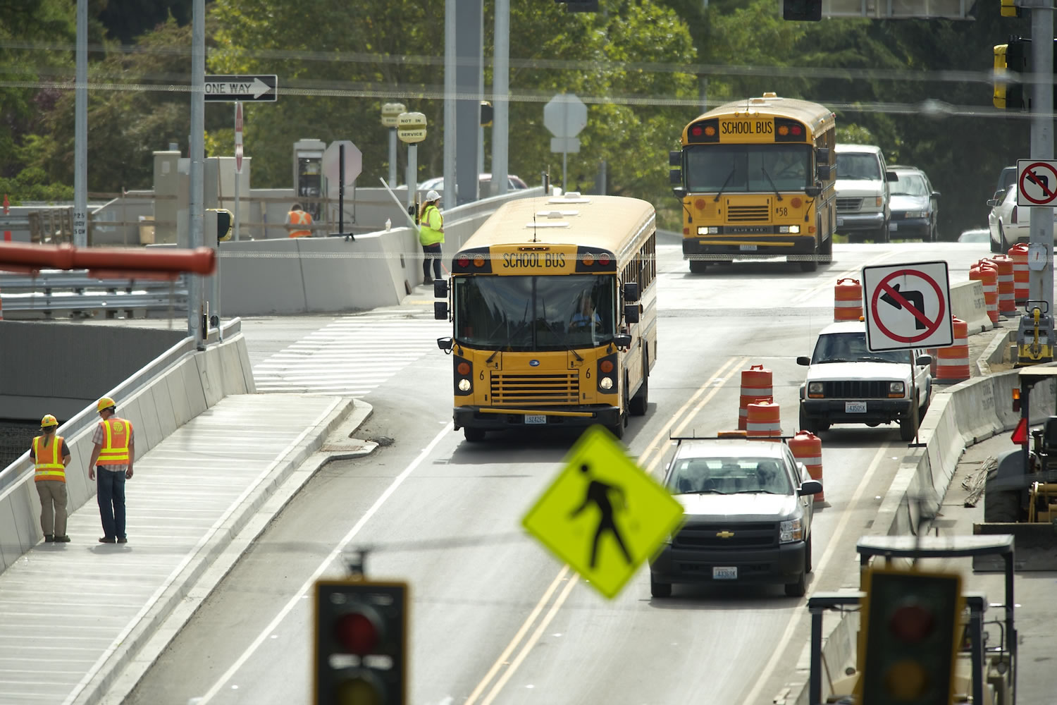 School buses and other traffic travel over the SR 500/St. Johns Blvd interchange Monday in Vancouver as the road construction project nears completion.