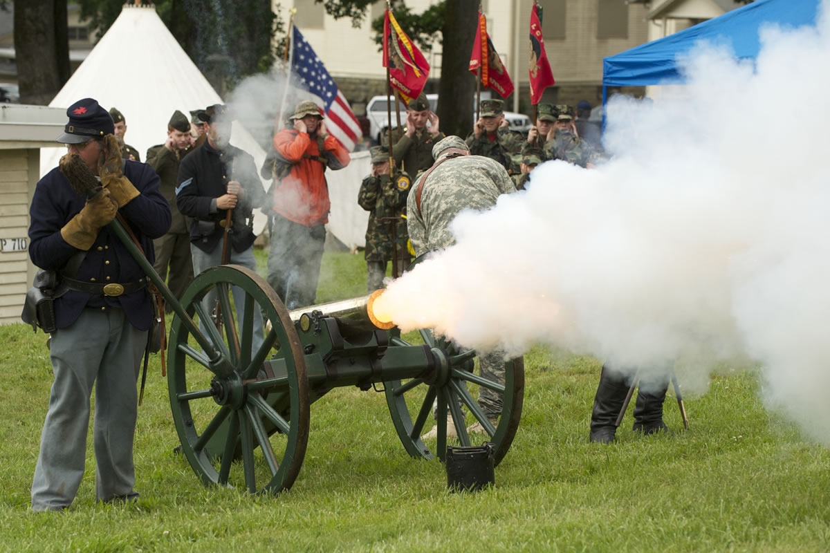 1st Oregon Volunteer Infantry re-enactors fire an 1841 Mountain Howitzer Cannon during a soldiers bivouac demonstration at the Vancouver Barracks on Memorial Day.