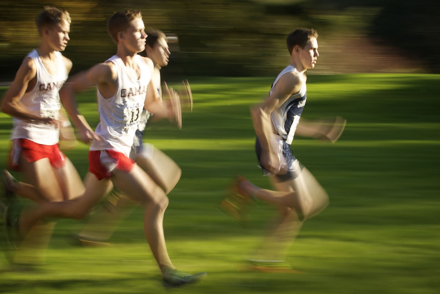 Kaden Harbertson, right, of Skyview High School competes in the Class 4A district cross country meet Wednesday at Lewisville Park near Battle Ground.