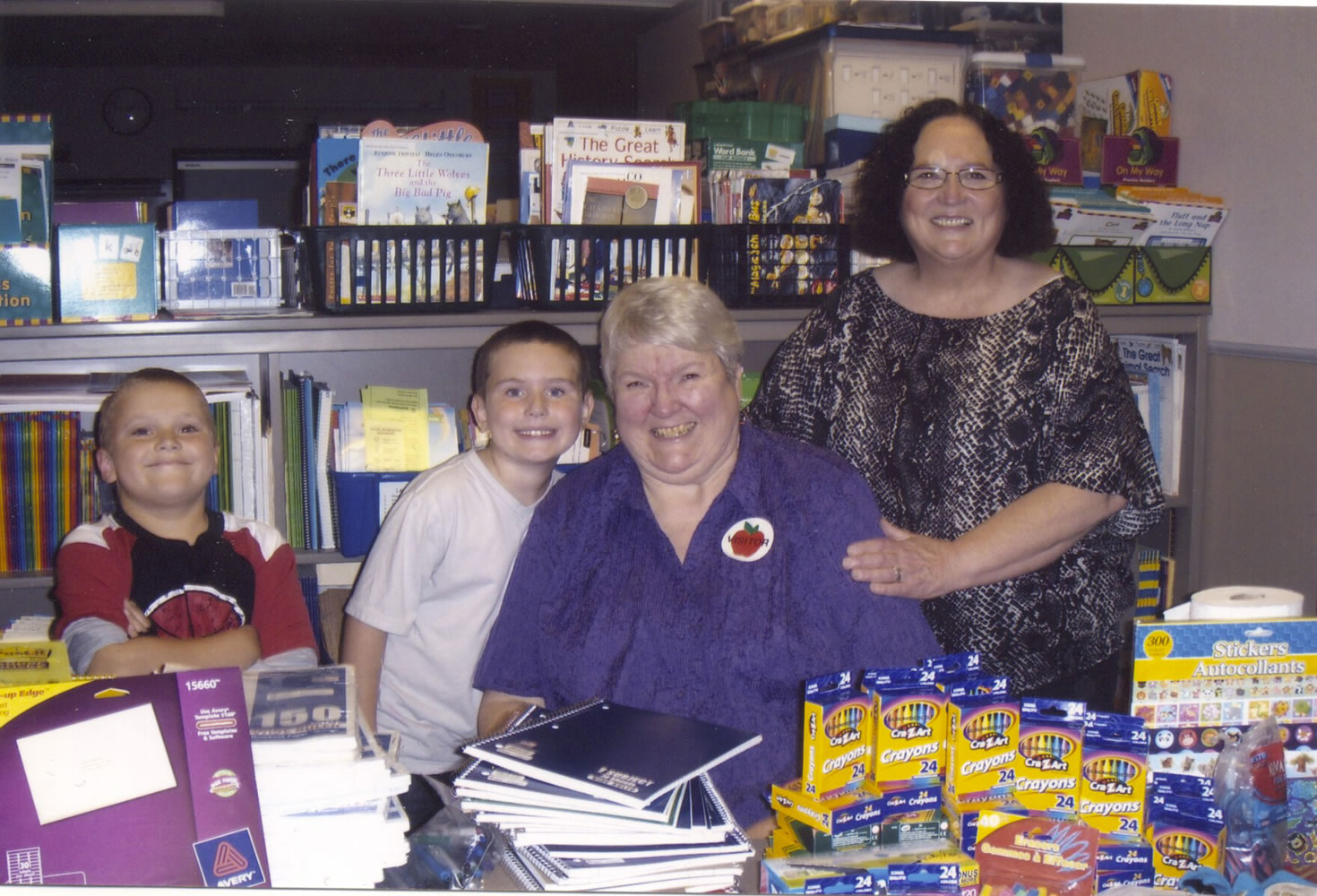 Hazel Dell: Oregon FL Club President Jody Morris (seated) is thanked by Hazel Dell Elementary School learning support teacher Marti Lloid and two of her students for donating a tableful of school supplies last month.