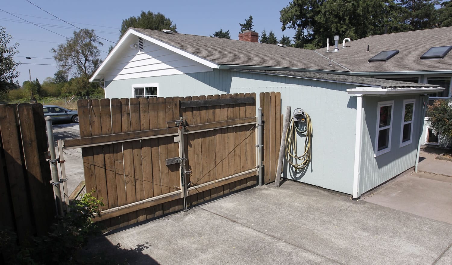 Boards are missing from a gate where an intruder entered the backyard at 3719 N.E. 54th Ave.