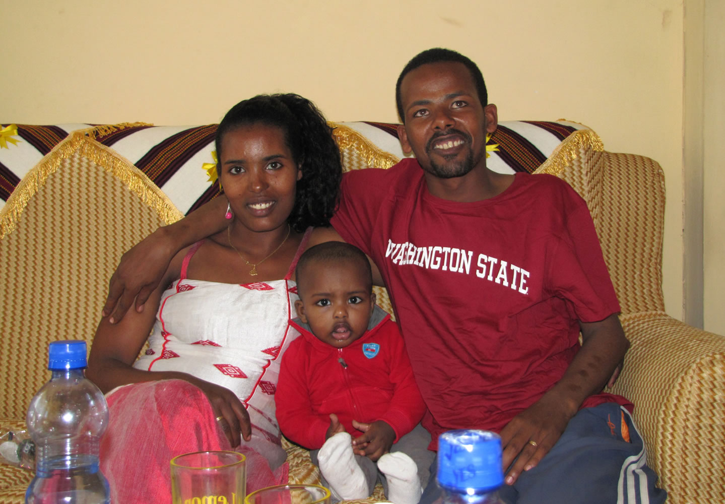 Barry Hewlett's Ethiopian doctoral student, Samuel Dira, and his wife and child.